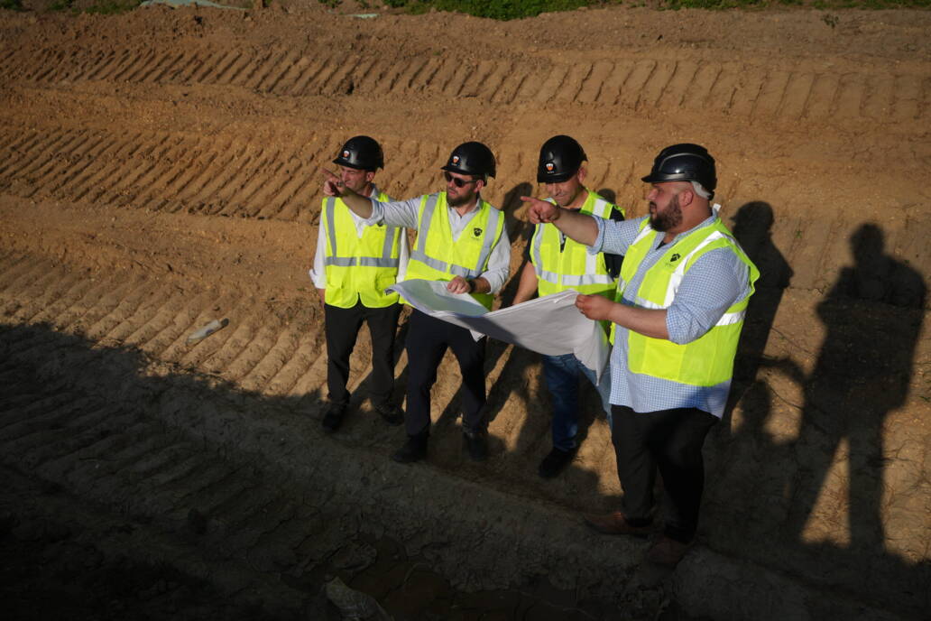 4 men on construction site