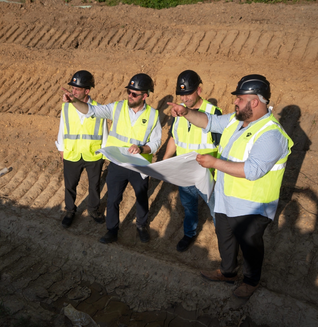 4 people discussing construction plans